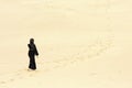 Woman walking by desert routes