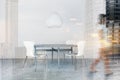 Woman walking in dining room with round table Royalty Free Stock Photo