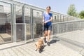 Woman walking a dog in animal shelter