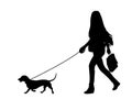 Woman walking a dog silhouette - vector Royalty Free Stock Photo