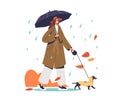 Woman walking with dog under umbrella during autumn rain wearing coat Royalty Free Stock Photo