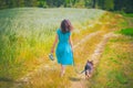 Woman walking with dog Royalty Free Stock Photo