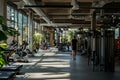 A woman is walking down a spacious and well-lit hallway in a gym facility, A snapshot of life inside a bustling, urban 24 7 gym,