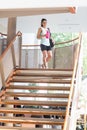 Woman walking down stairs Royalty Free Stock Photo