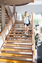 Woman walking down stairs Royalty Free Stock Photo