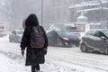 Woman walking in Downtown Montreal during snow storm