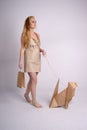 Woman walking eco dog holding eco-friendly bag Royalty Free Stock Photo