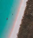 Woman walking and enjoying empty paradise tropical beach. Nobody around. Aerial view of Padar island Pink Beach