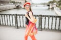 Woman walking with french food in Paris