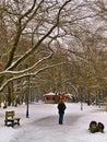 Woman walking on frozen path, in a park in Naousa, Greece