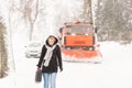 Woman walking with gas can winter car Royalty Free Stock Photo