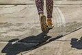 Woman Walking With Golden Sneakers Royalty Free Stock Photo