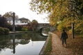 Woman walking grand union canal towpath berkhamsted uk Royalty Free Stock Photo