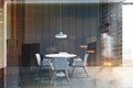 Woman walking in gray dining room Royalty Free Stock Photo