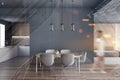 Woman walking in gray dining room