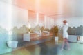 Woman walking in green tile bathroom with toilet Royalty Free Stock Photo