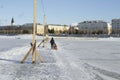 Woman walking with her child on a pedestrian crossing over a frozen river Royalty Free Stock Photo