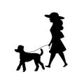 Woman walking with her poodle dog silhouette Royalty Free Stock Photo