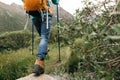 Woman walking in high altitude mountains Royalty Free Stock Photo