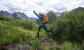 Woman walking in high altitude mountains Royalty Free Stock Photo