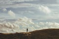 A woman walking on the hills near Brora Village in Highlands of Scotland