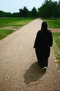 Woman walking in Hyde Park, London