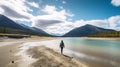 Woman walking through lake in the mountains