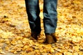 Woman walking on leaves