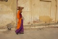 Woman walking with a load Royalty Free Stock Photo