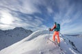 A women walking in the mountains on a sunny day