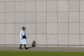 Woman Walking At The Museumplein Square With The Wall Of The Van Gogh Museum At Amsterdam The Netherlands 5-2-2022 Royalty Free Stock Photo