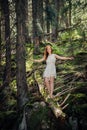 Woman walking in the mystery forest