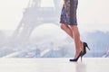 Woman walking near the Eiffel tower Royalty Free Stock Photo