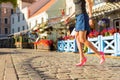 Woman walking in old town Royalty Free Stock Photo