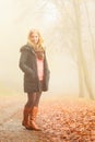 Woman walking in park in foggy day Royalty Free Stock Photo