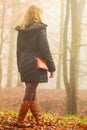 Woman walking in park in foggy day Royalty Free Stock Photo