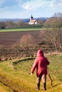 Woman walking on a path outdoors, hiking pratice for relaxing and staying healthy