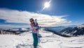 Katschberg - A woman walking on powder snow with her snowboard Royalty Free Stock Photo