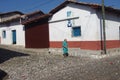 Woman walking quiet street in Suchitoto