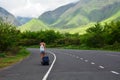 Woman walking on the road and exploring the beautiful valley of hawaii