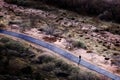 Woman Walking or Running on Path Bikepath in Desert Town Royalty Free Stock Photo