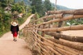 Woman walking rural village