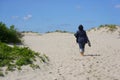 Woman walking on the sand Royalty Free Stock Photo