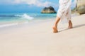 Woman walking in sand on the beach Royalty Free Stock Photo