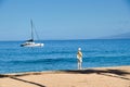 Woman walking the sand at Ka`anapali Beach on Maui. Royalty Free Stock Photo