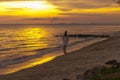 Woman walking at shore alone Royalty Free Stock Photo