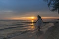 Woman walking at shore alone Royalty Free Stock Photo