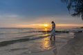 Woman walking at shore alone Royalty Free Stock Photo