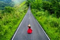 Woman walking on sky road over top of mountains with green jungle in Nan province, Thailand Royalty Free Stock Photo