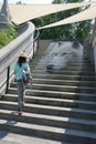 Woman Walking Stairs with Eco Art Royalty Free Stock Photo